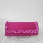 Clutch pesta batuan warna fuchsia magenta dengan pinggiran payet kristal Za'Nis Bag